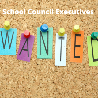 Cork board with individual letters pinned on it saying "wanted"