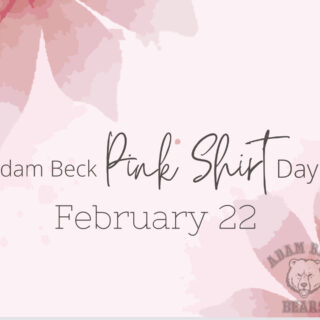 Word "Pink Shirt Day February 22" on a light pink background with darker pink flower petals in left and bottom right corners